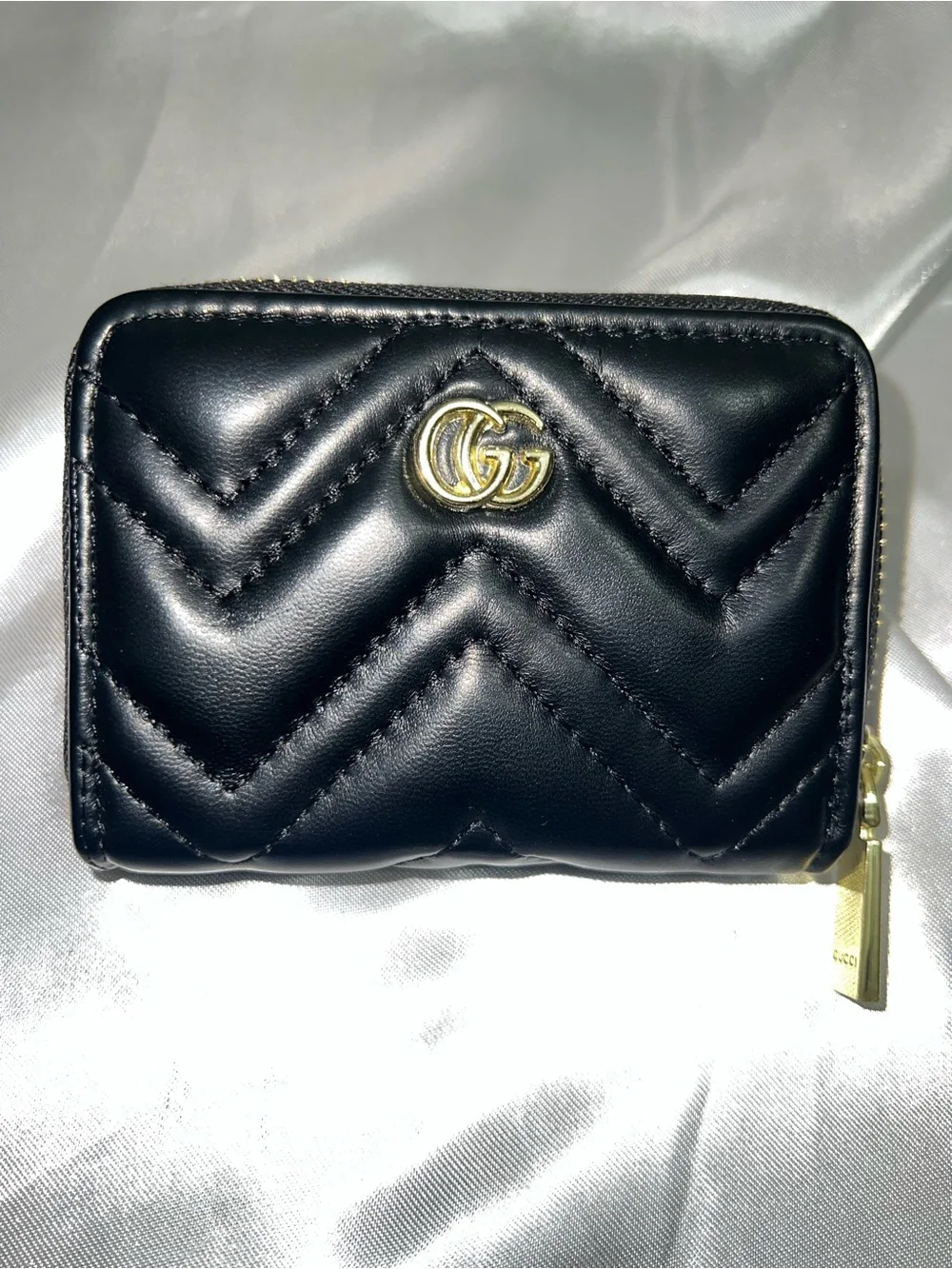 Black Quilted Leather Zip Wallet with Gold Emblem